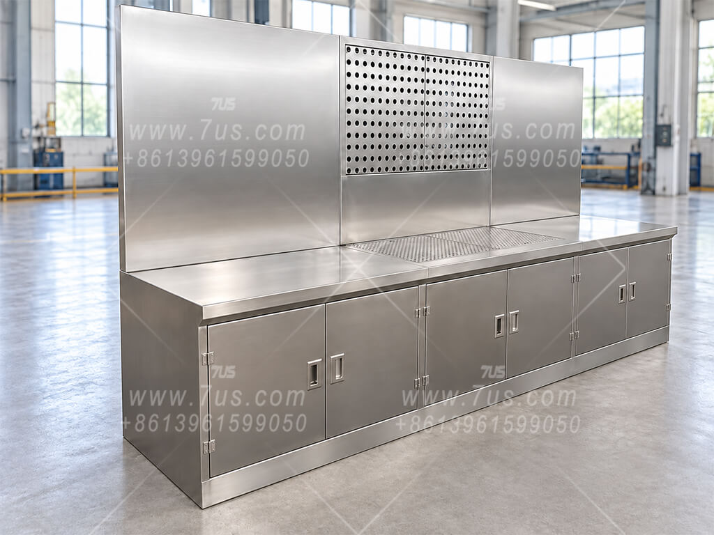 Extended stainless steel worktable with perforated tabletop and rear extraction panel