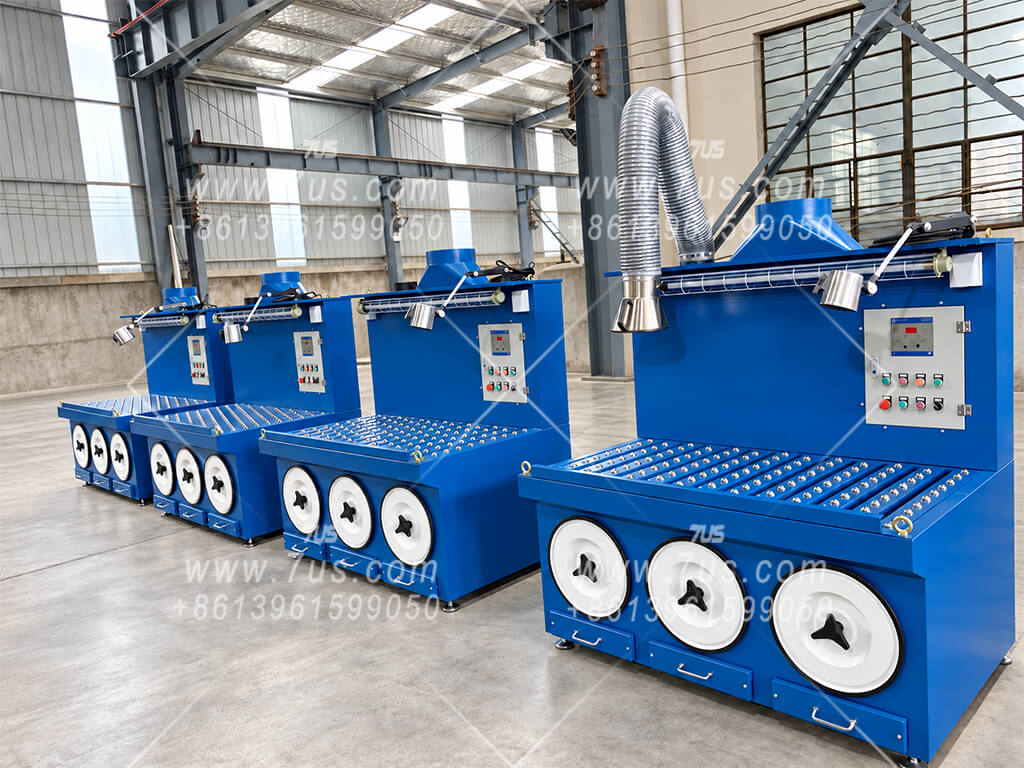 Blue worktables with built-in filter cartridges, adjustable extraction arms and separately installed extraction fans