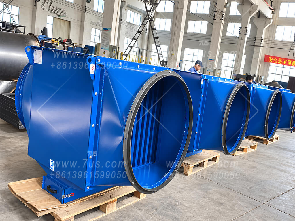 Blue baffle spark arrestors assembled on pallets in the workshop