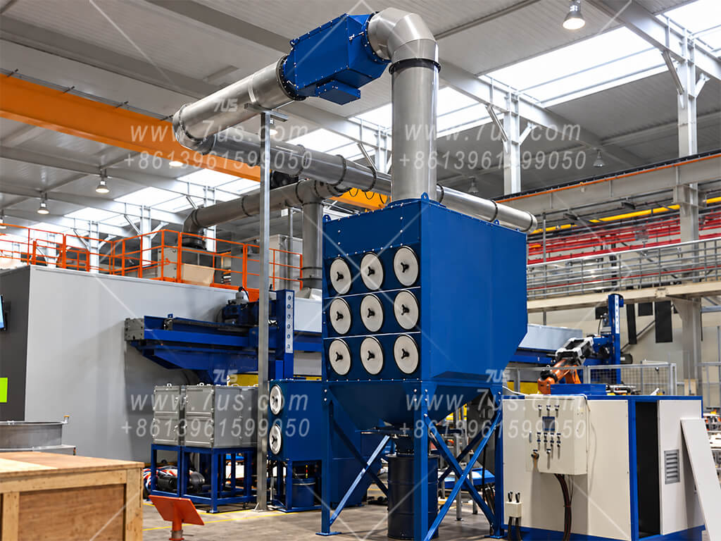 Baffle spark arrestor upstream of a cartridge dust collector serving a robotic welding cell